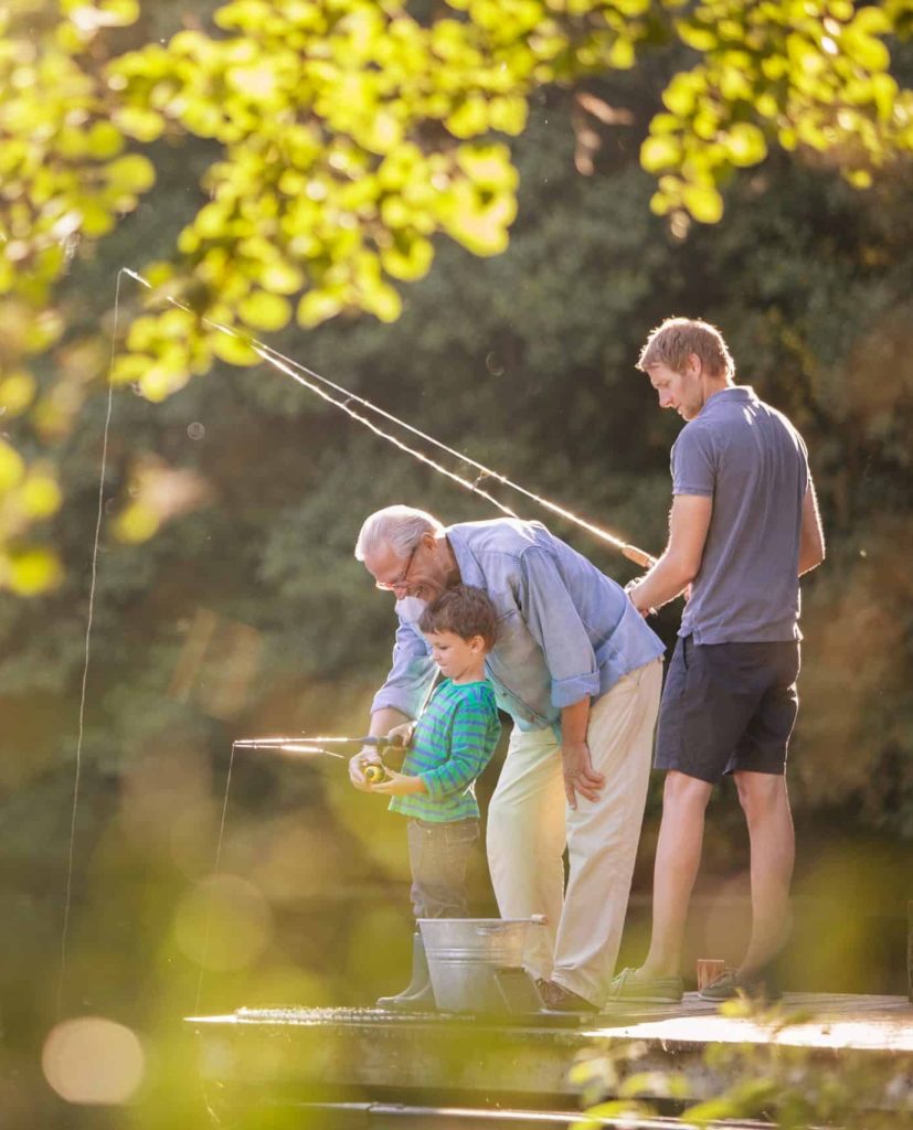 Boy father and grandfather fishing